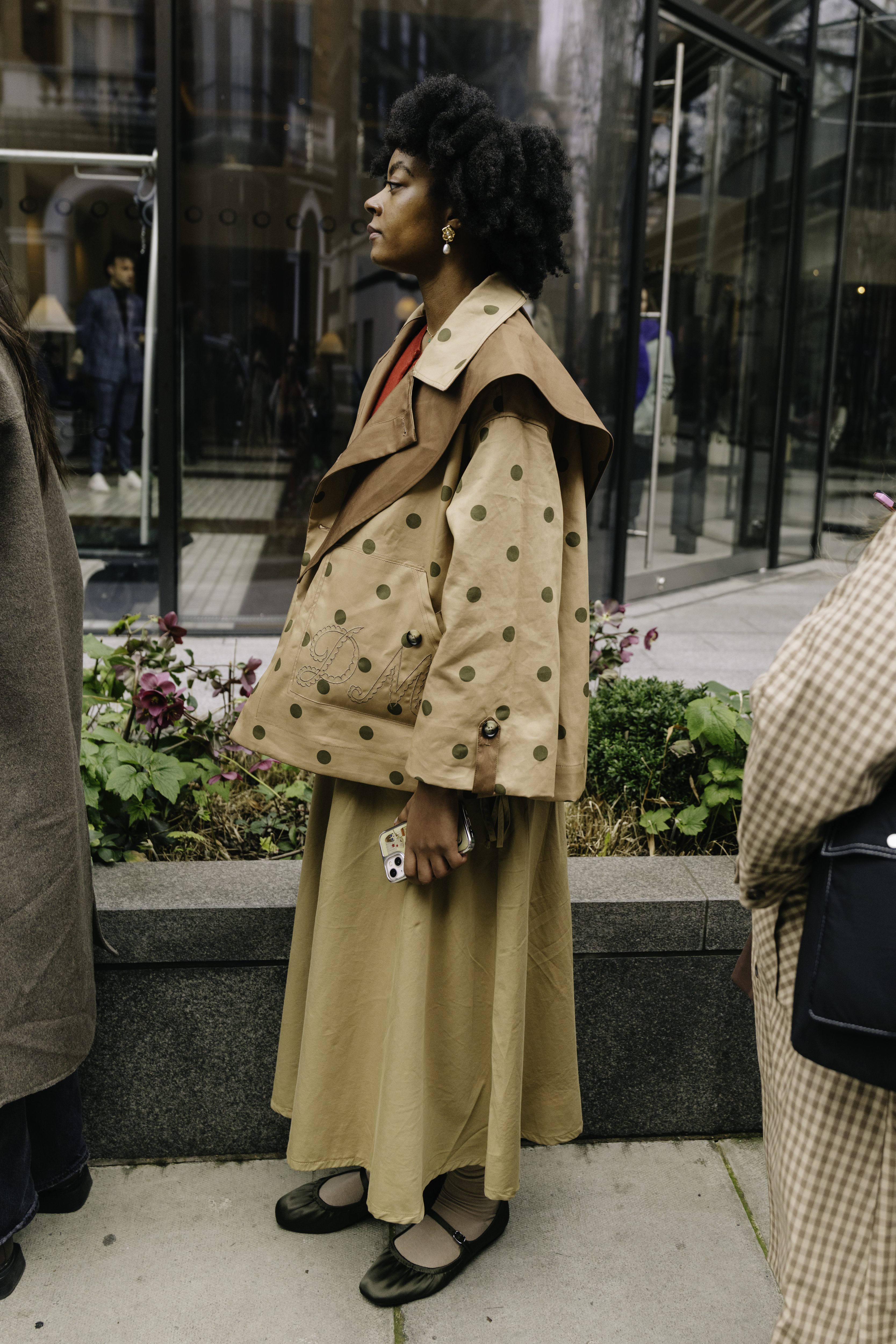 a woman wears ballet flats
