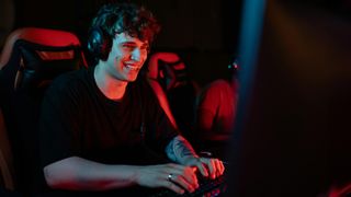 Man wearing headphones at computer desk