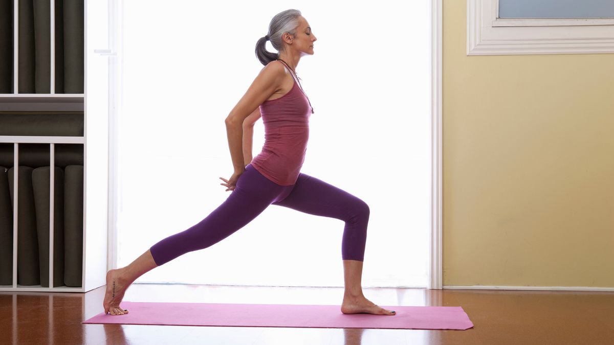 Is yoga good for you? Women standing on a yoga mat in a yoga pose