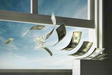Dollar bills flying out an open window