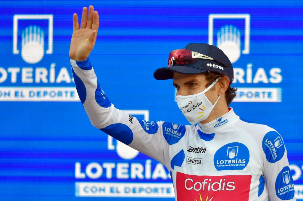 Team Cofidis rider Frances Guillaume Martin waves on the podium wearing the best climbers dotted jersey after the 7th stage of the 2020 La Vuelta cycling tour of Spain a 1597 km race from VitoriaGasteiz to Villanueva de Valdegovia on October 27 2020 Photo by ANDER GILLENEA AFP Photo by ANDER GILLENEAAFP via Getty Images