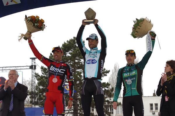 The three podium finishers take the applause