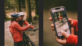 Mountain bike coach shows video on phone