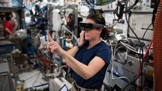 NASA astronaut Megan McArthur testing a virtual reality headset during experiments at the International Space Station.