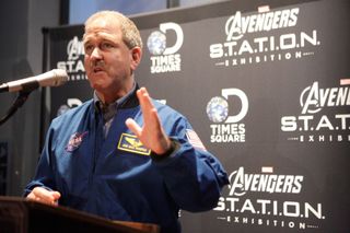 Astronaut John Grunsfeld, NASA associate administrator for science missions, speaks to guests at an opening reception for Marvel's Avengers S.T.A.T.I.O.N.