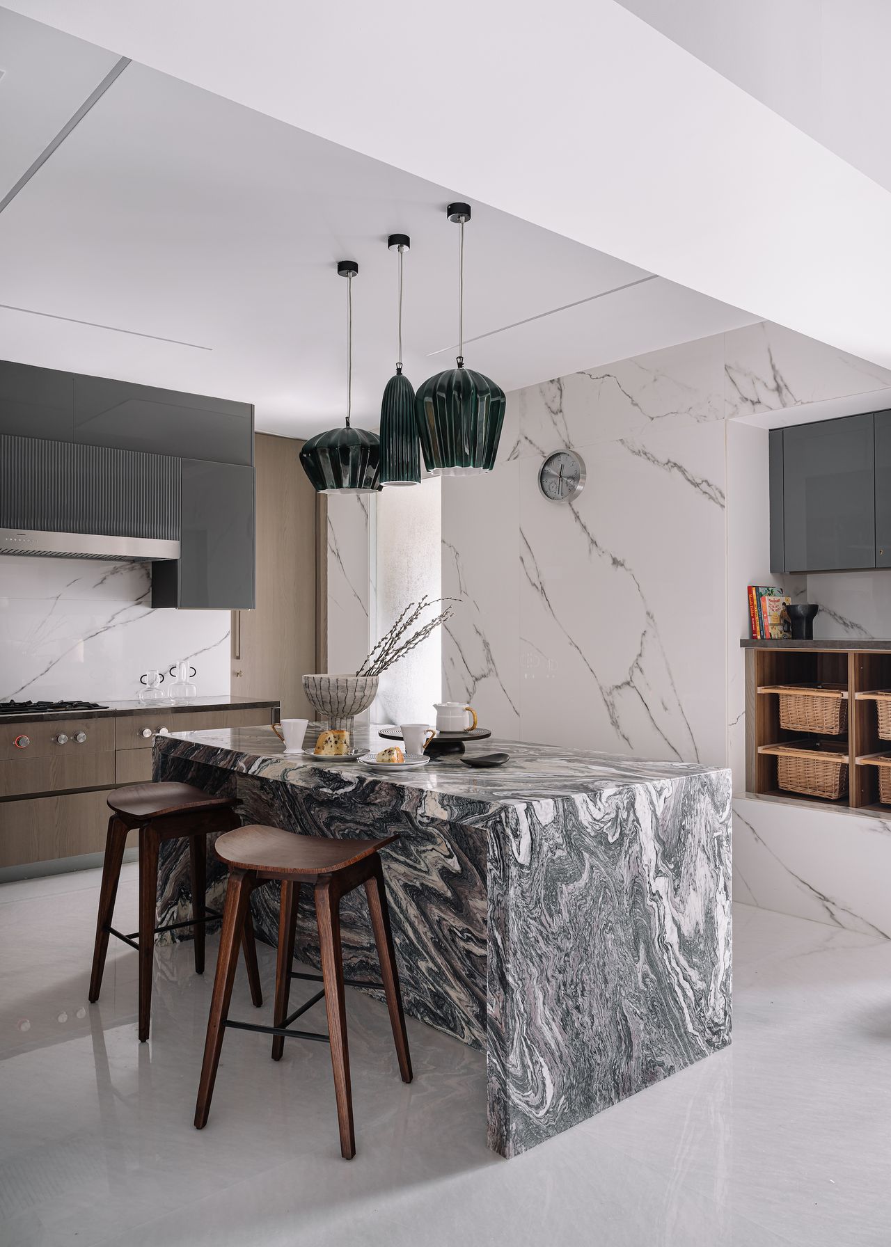A kitchen with dark gray kitchen island
