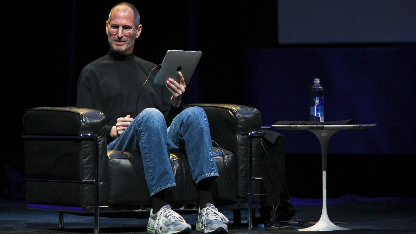 Apple CEO Steve Jobs holds the iPad during the launch of Apple's new tablet computing device in San Francisco