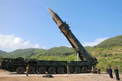 North Korean leader Kim Jong Un is seen inspecting the intercontinental ballistic missile Hwasong-14 launched Tuesday from an undisclosed location.