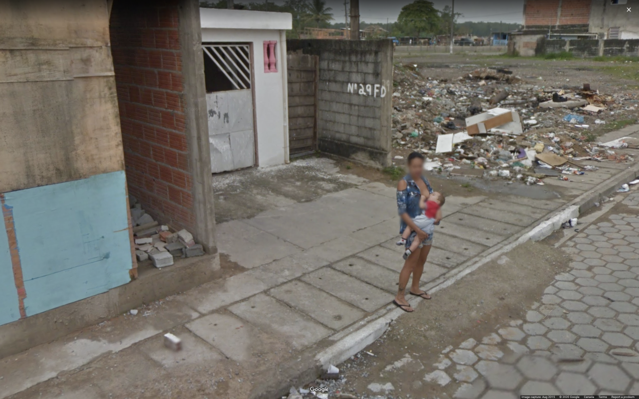 A woman is captured breastfeeding with on Google Street View camera