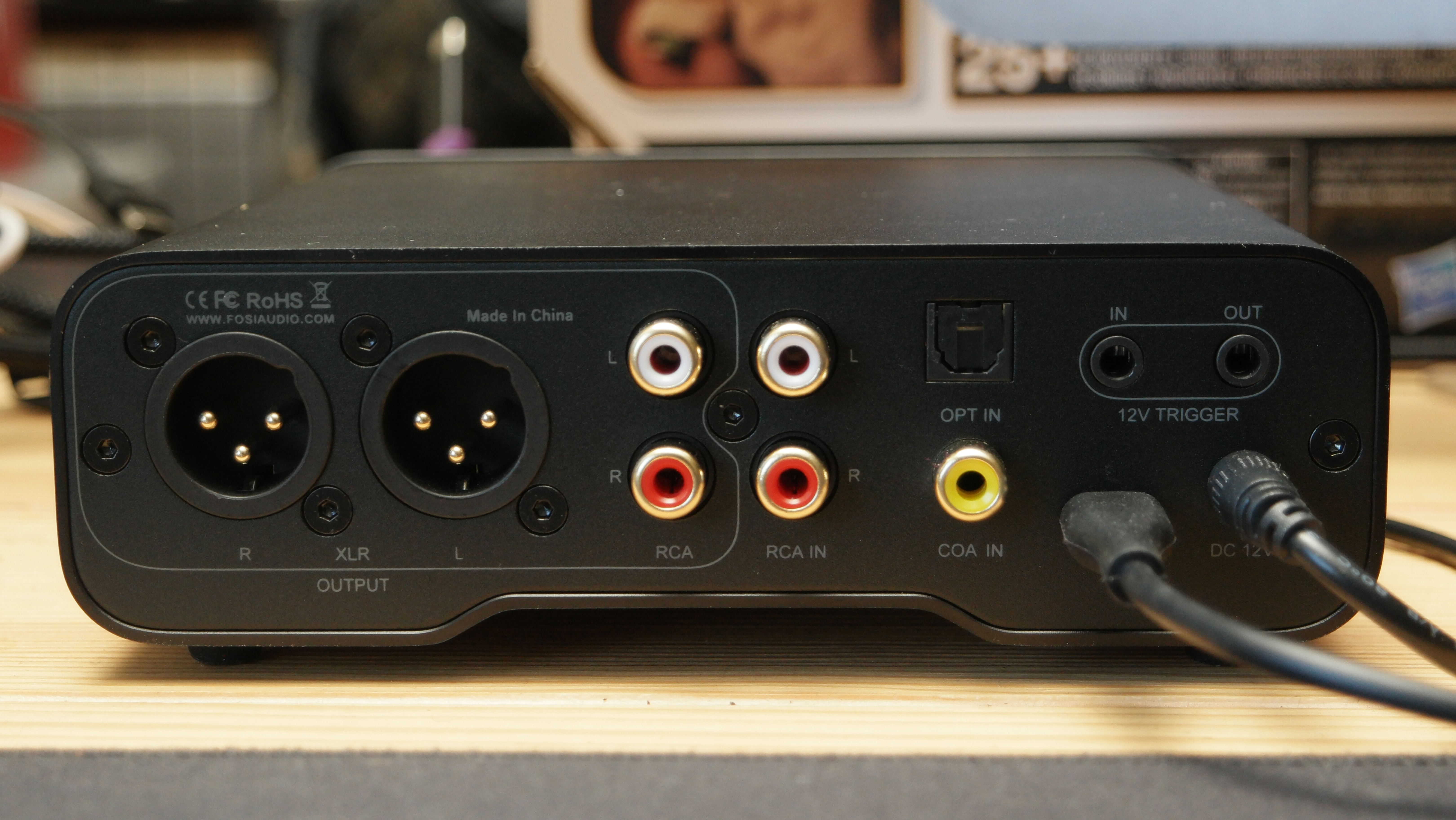 Fosi Audio ZH3 desktop DAC/Amp on a desk, showing its outputs