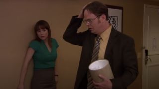 Rainn Wilson and Erin looking shocked in The Office