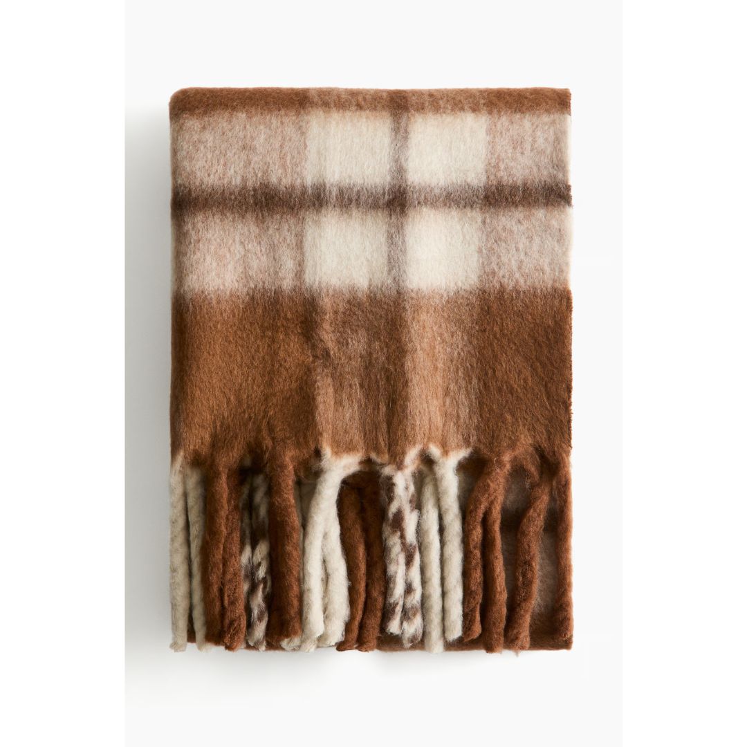 brown and white wool blanket with fringe