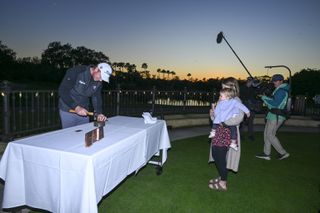 Hayden Springer uses a hammer on his PGA Tour card