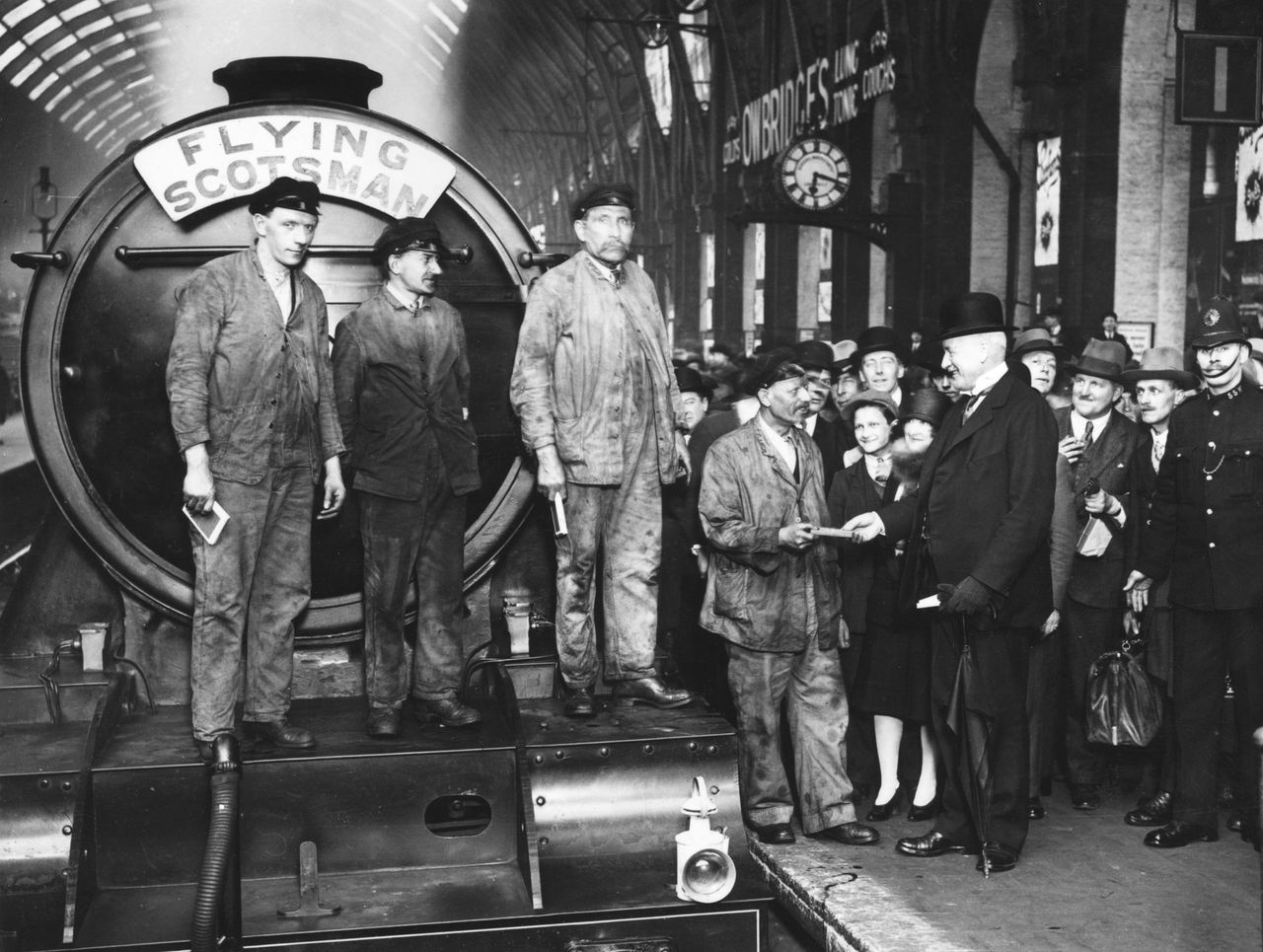 1st May 1928: The arrival of the Flying Scotsman at King&#039;s Cross railway station in London. William Whitelaw (right) greets (from right to left) driver J Day, fireman Gray, fireman McKenzie and driver Henderson. (Photo by W. G. Phillips/Topical Press Agency/Getty Images)