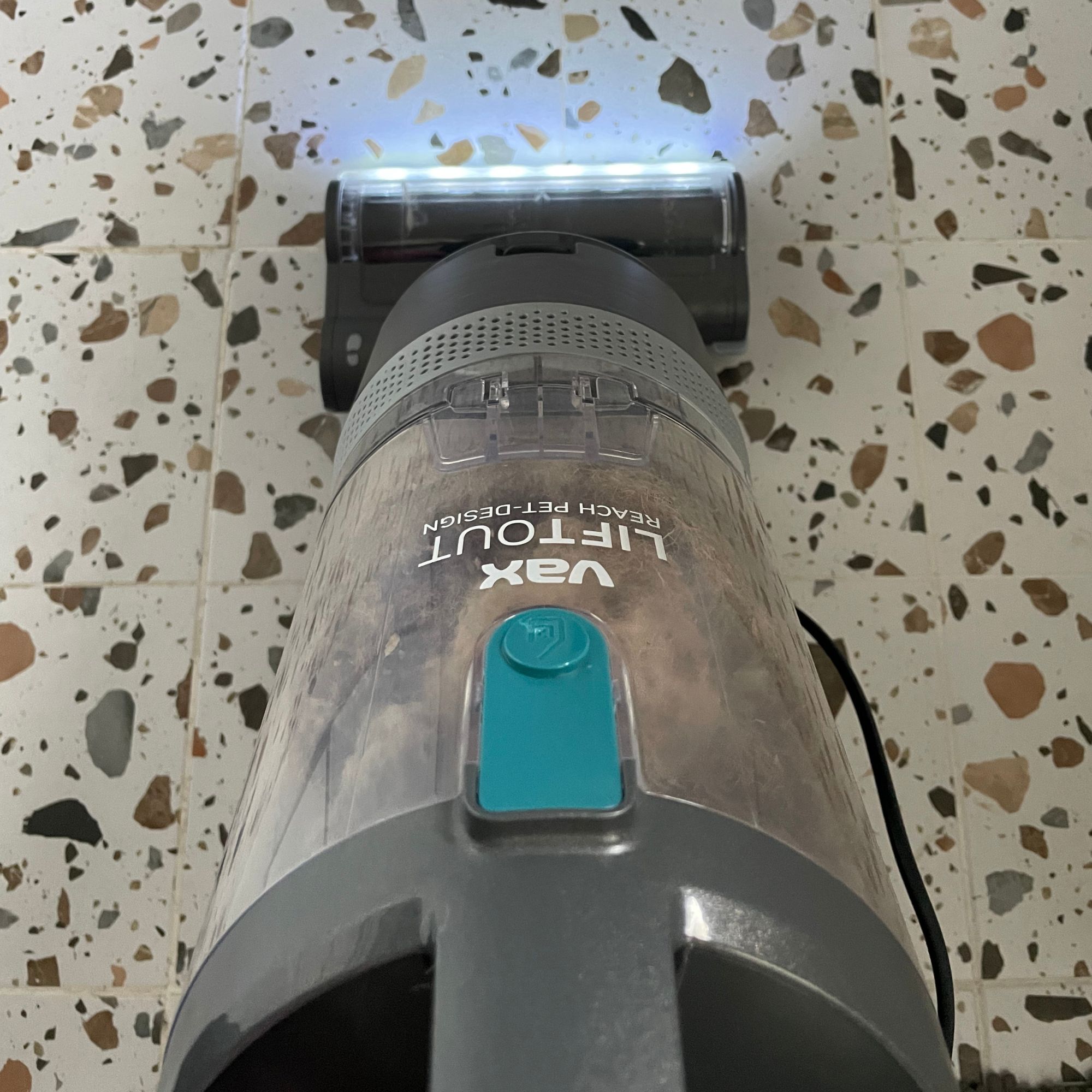 Vax LiftOut Reach Pet Design Vacuum Cleaner cleaning terrazzo tiles in a kitchen