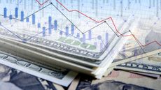 Close up of dollar bills overlaid with line graph and bar chart