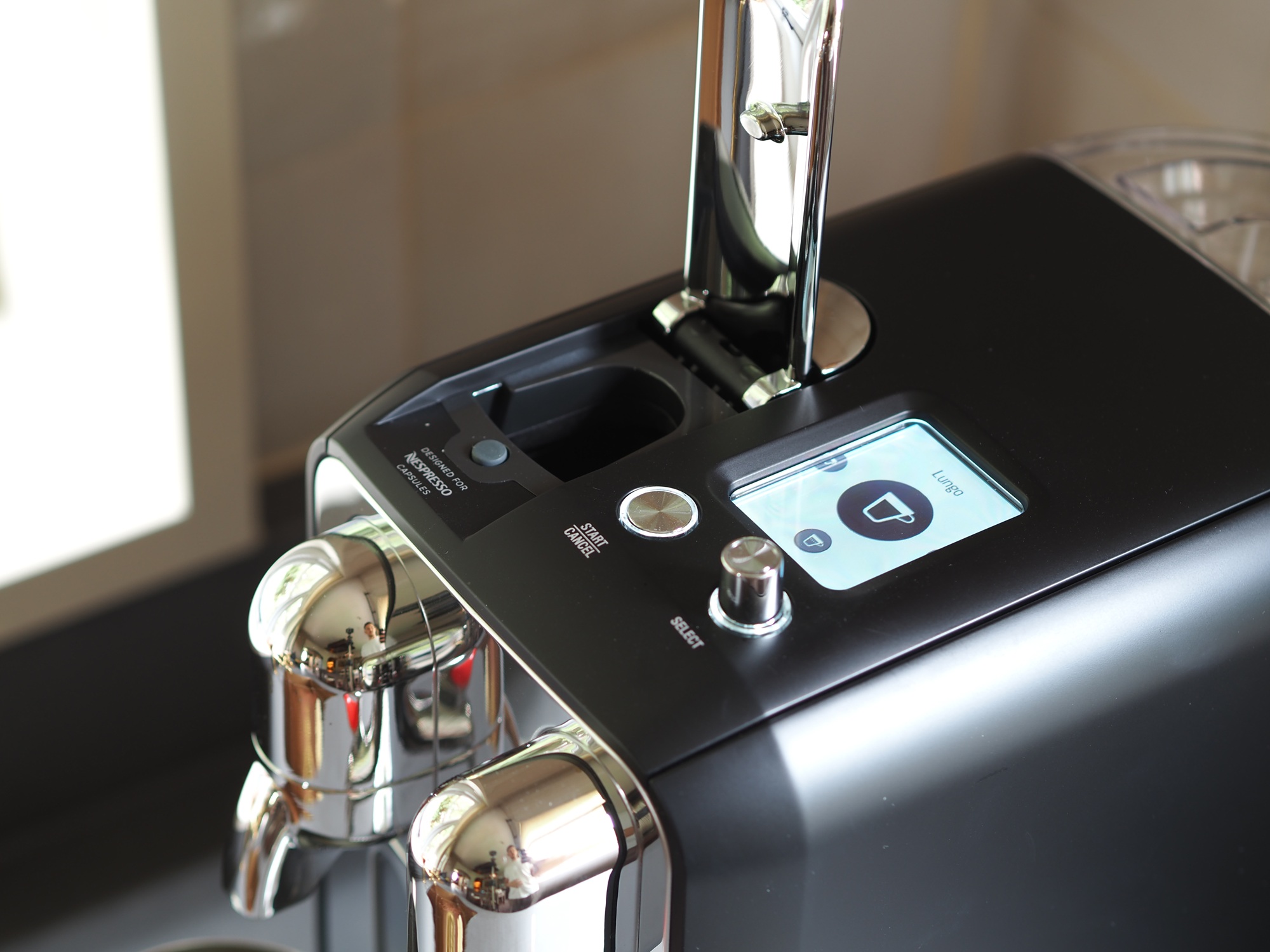Close up of nespresso creatista plus by sage, being used to make a coffee