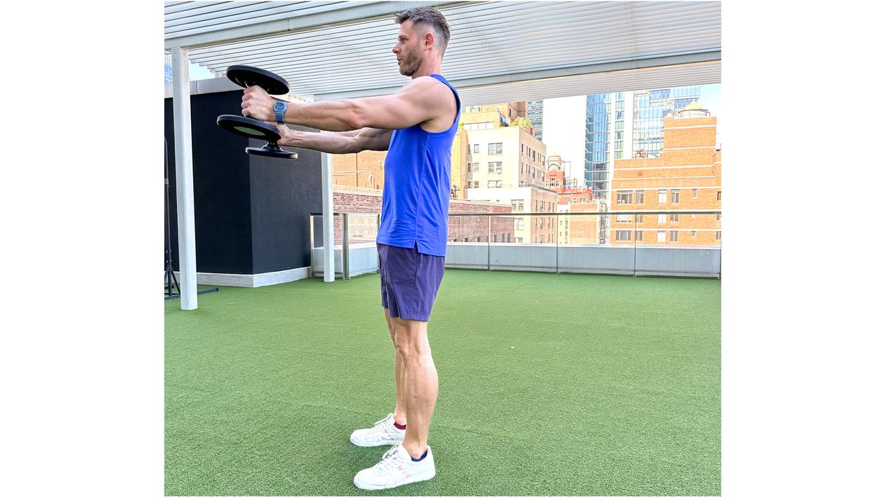 Andy Speer finishing a dumbbell swing