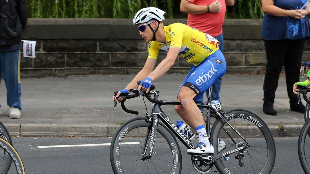 Julien Vermote stays safely in the peloton
