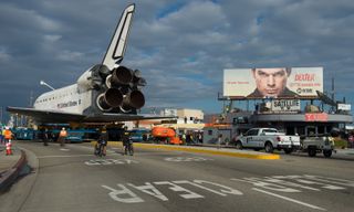 The space shuttle Endeavour is seen as it traverses through Inglewood, California on Friday, Oct. 2012.
