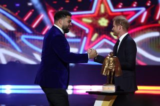 Prince Harry, Duke of Sussex presents the Walter Payton Man of the Year Award to Cameron Heyward of the Pittsburgh Steelers at the 13th Annual NFL Honors on February 8, 2024 in Las Vegas, Nevada