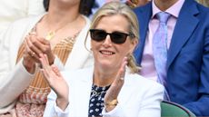 Duchess Sophie claps, wearing sunglasses, as she watches the tennis at Wimbledon 2025