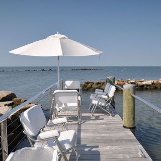 dock with white chair and sea view