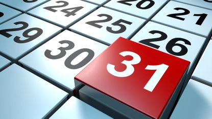 Close up of dates on calendar with 31 highlighted prominently in white text on red background 
