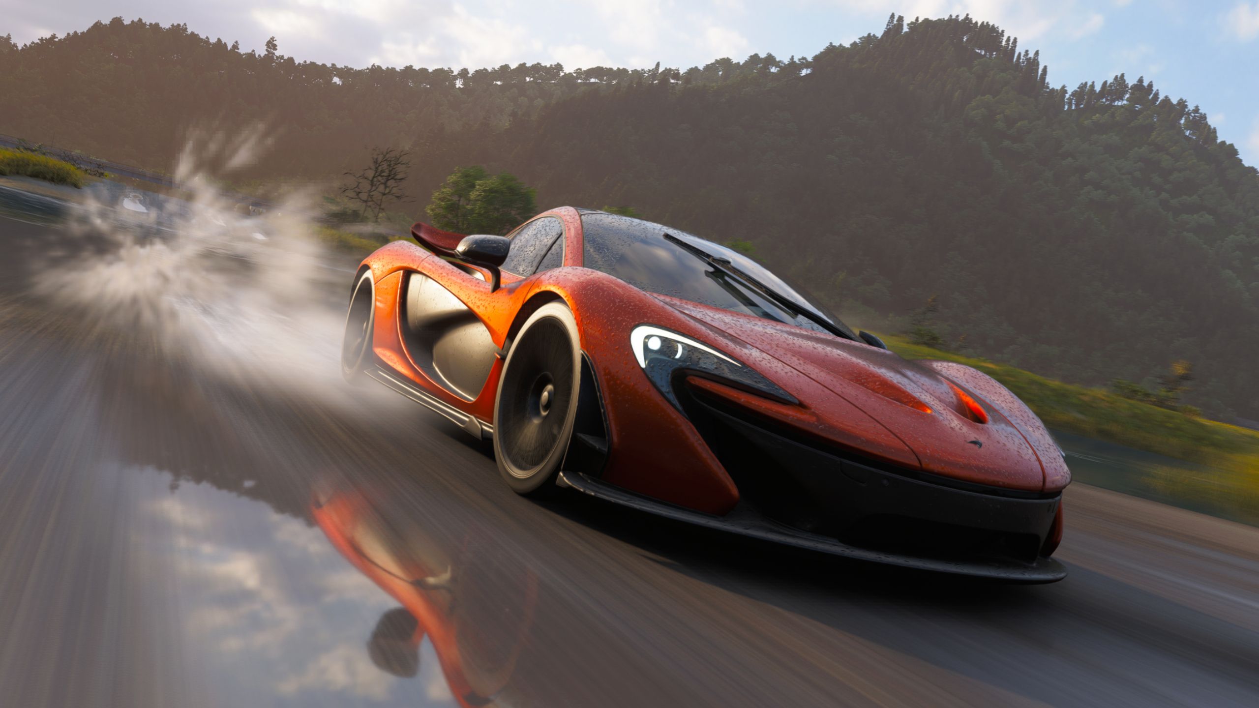 Une voiture classique courant à travers un paysage enneigé dans Forza Horizon 6, illustrant les divers environnements du jeu.