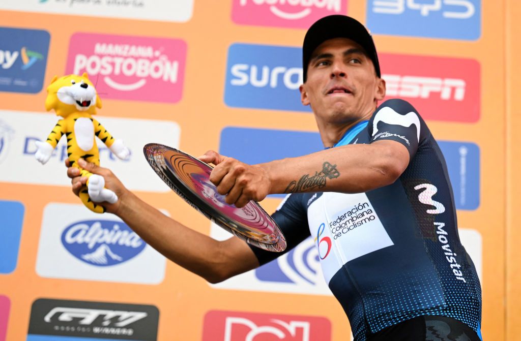 Colombia's Jhonatan Restrepo celebrates his stage win on the podium
