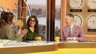 Valerie Bertinelli sits at the news desk of 'The Drew Barrymore Show' with Barrymore and Drew's News co-host Ross Mathews.