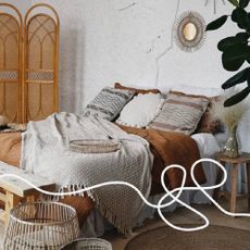 A boho chic style bedroom with a mattress from Eve Sleep.
