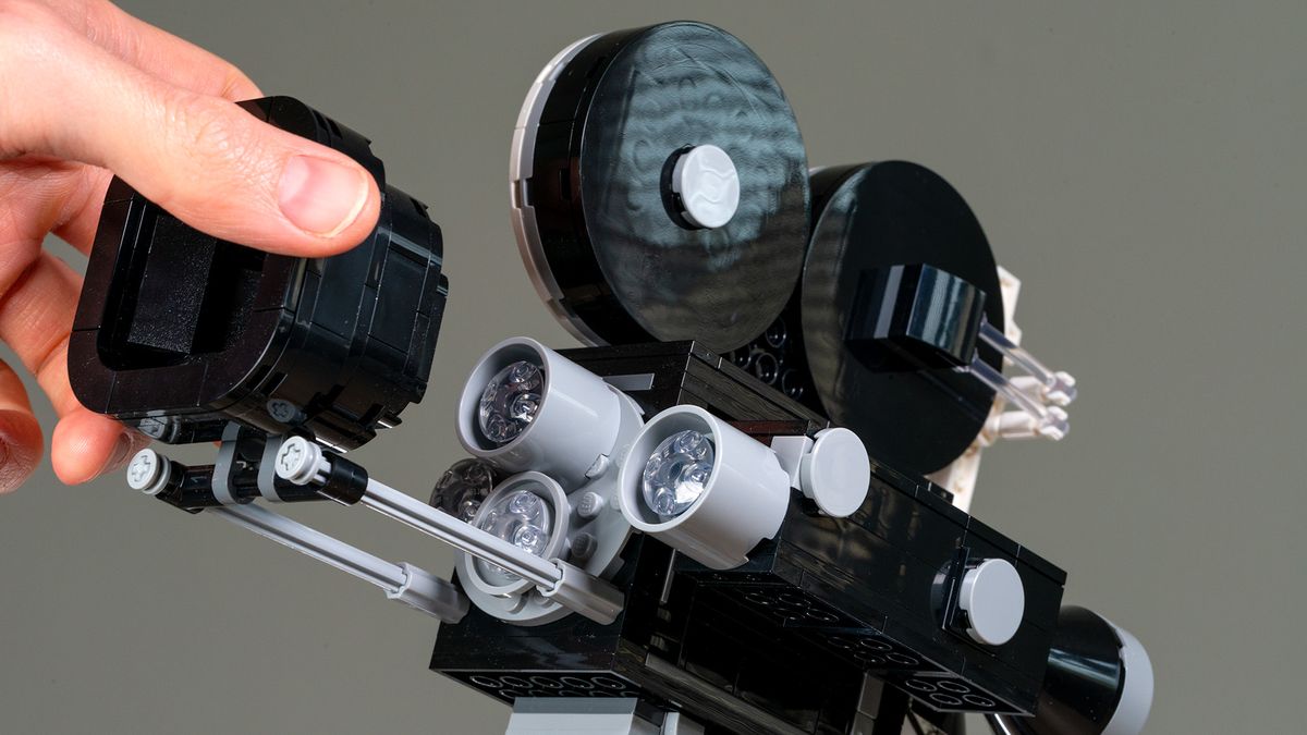 Lego Walt Disney Tribute Camera (43230) close-up of hand moving the sliding matte box to reveal the lenses