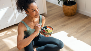 Woman eating healthy meal before workout