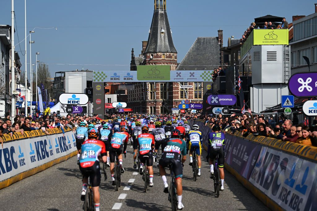 SCHOTEN BELGIUM APRIL 05 A general view of the peloton passing through Schoten City while fans cheer during the 111th Scheldeprijs 2023 Mens Elite a 2053km one day race from Terneuzen to Schoten on April 05 2023 in Schoten Belgium Photo by Luc ClaessenGetty Images