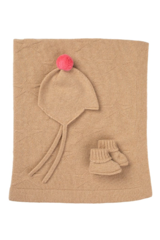 camel cashmere blanket, baby boots and bonnet with a pink pom pom