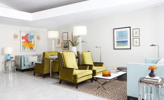 Room with rug on floor and yellow coloured couch