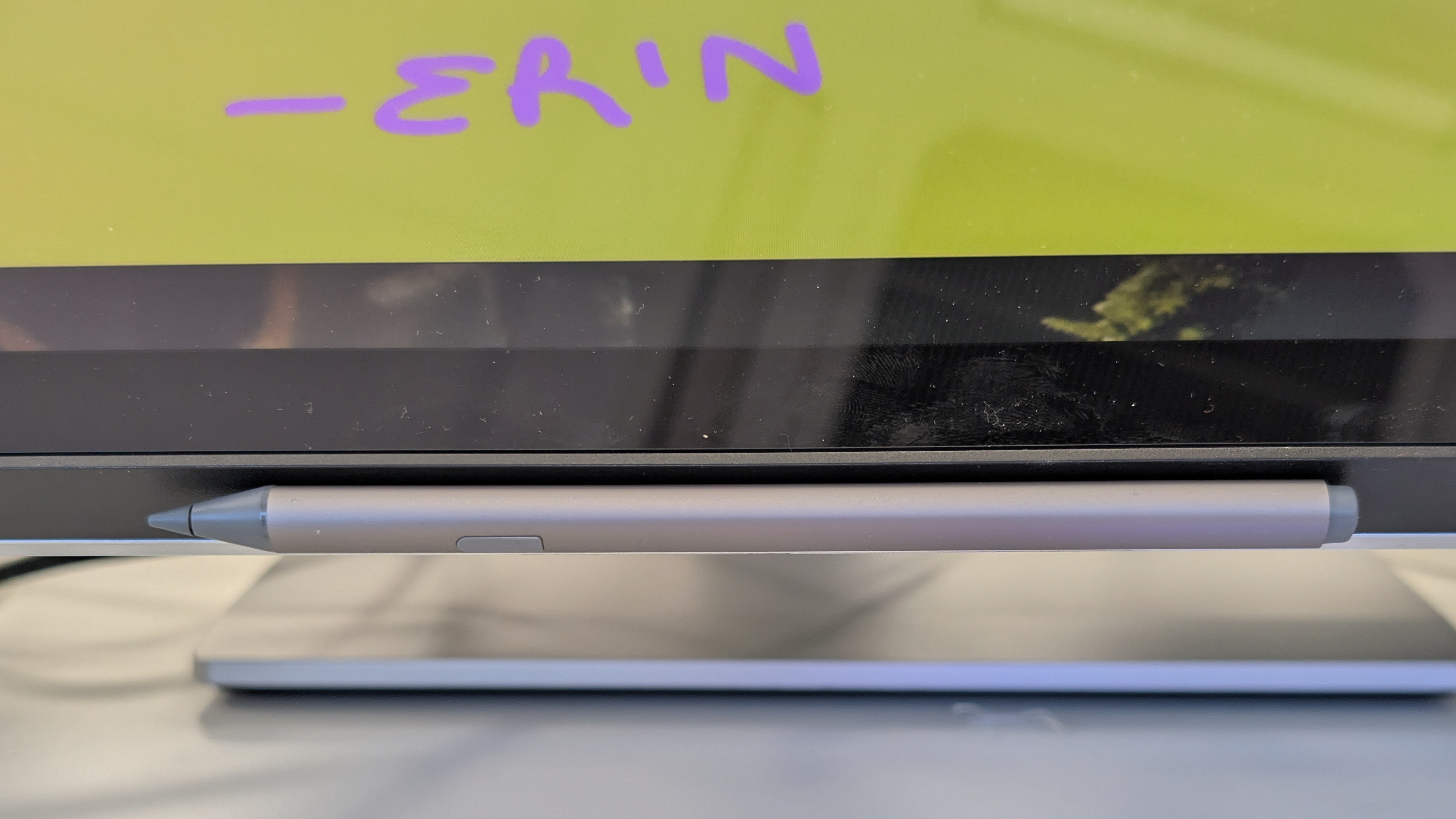 A stylus being used with an Alogic Clarity 6K Touch monitor