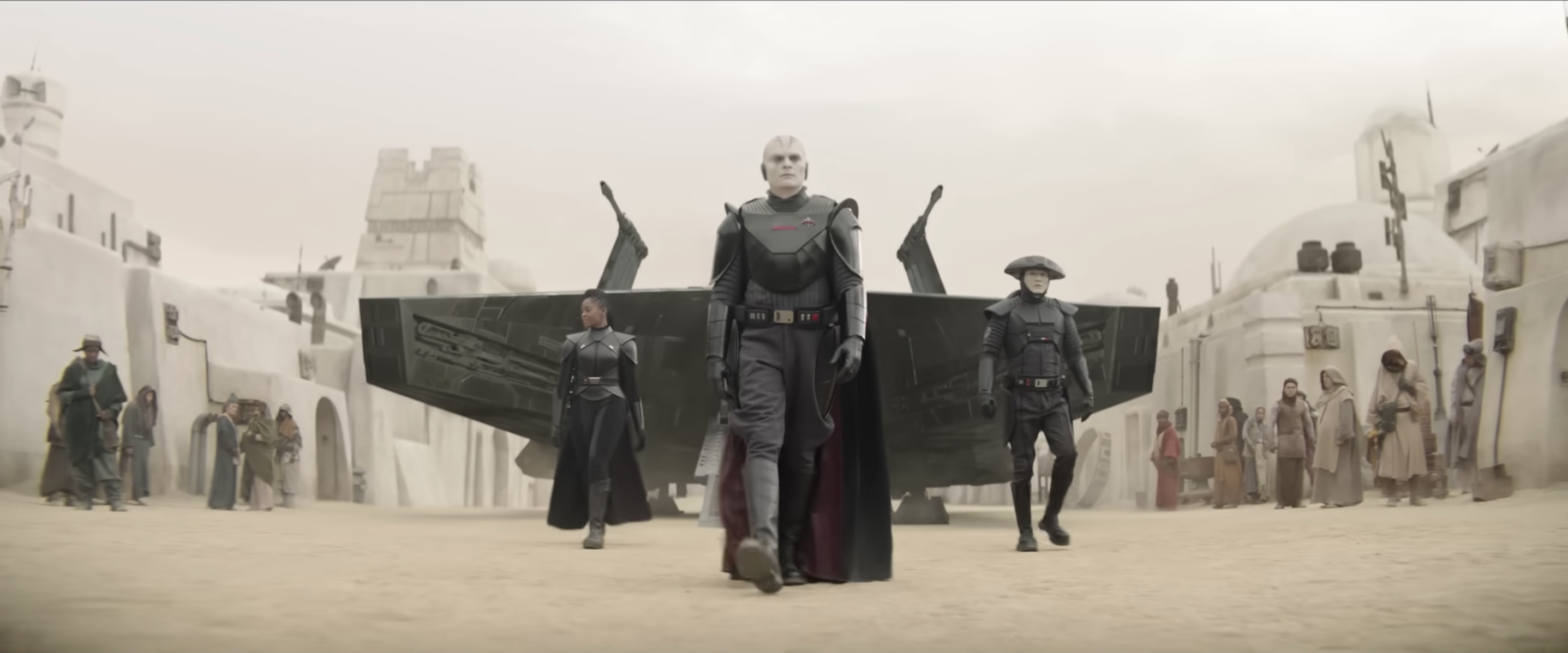 Rupert Friend as The Grand Inquisitor in Obi-Wan Kenobi, marching outside of a ship alongside Fifth Brother and Third Sister