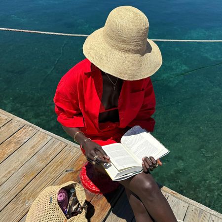 amy lefevre wearing a raffia hat