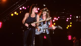 Bon Jovi's Richie Sambora (left) and Snake Sabo perform onstage at Giants Stadium in East Rutherford, New Jersey on June 11, 1989