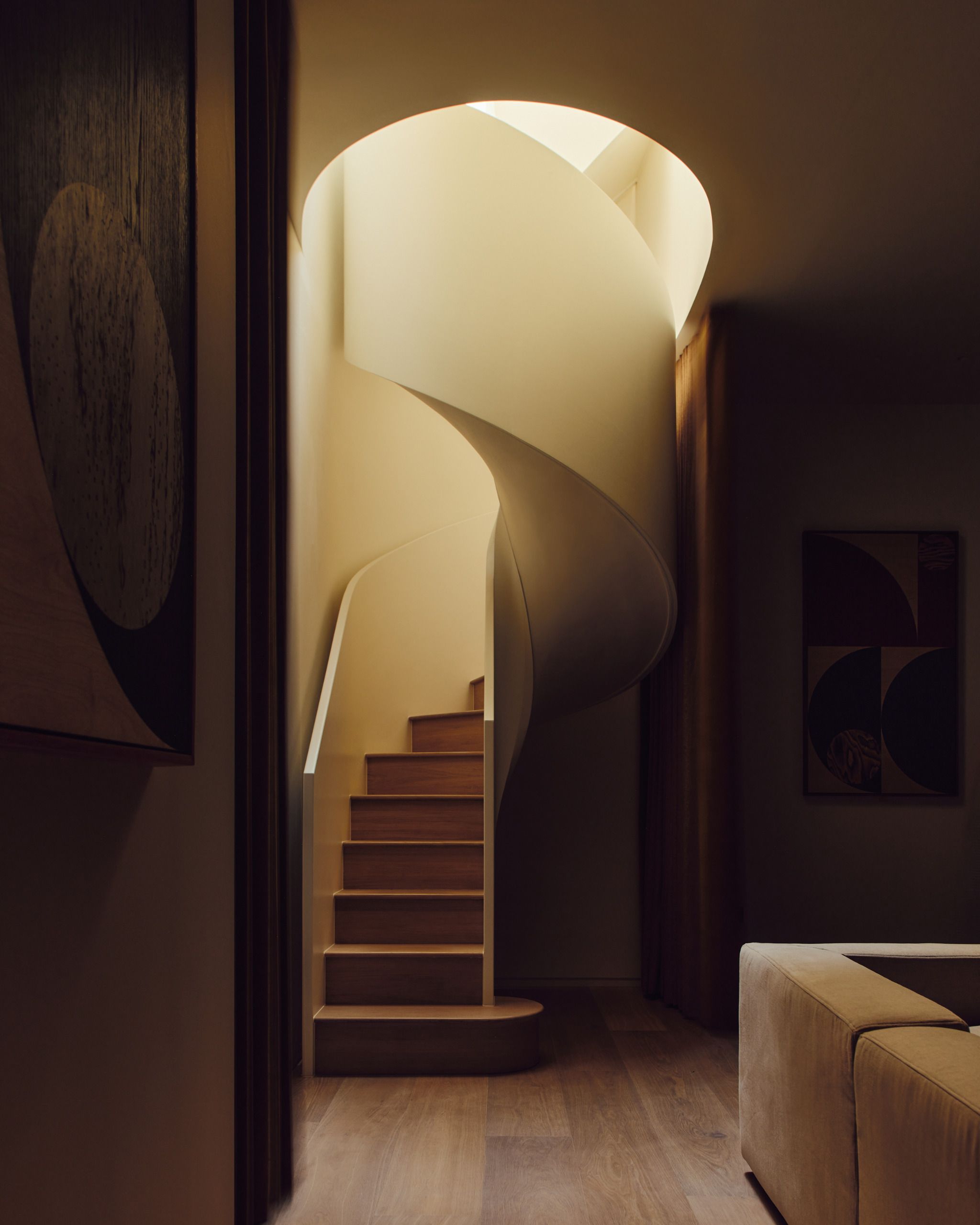 Spiral staircase from the basement leading back up to main floor