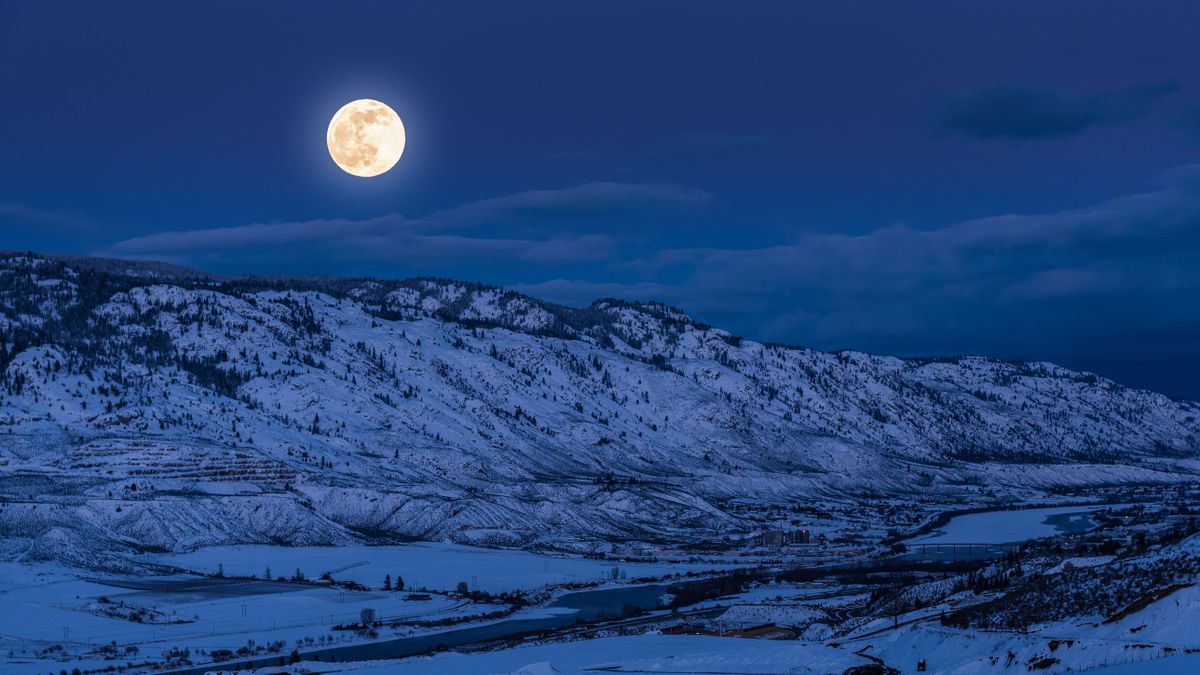 A full supermoon rises over Kamloops, British Columbia, Canada