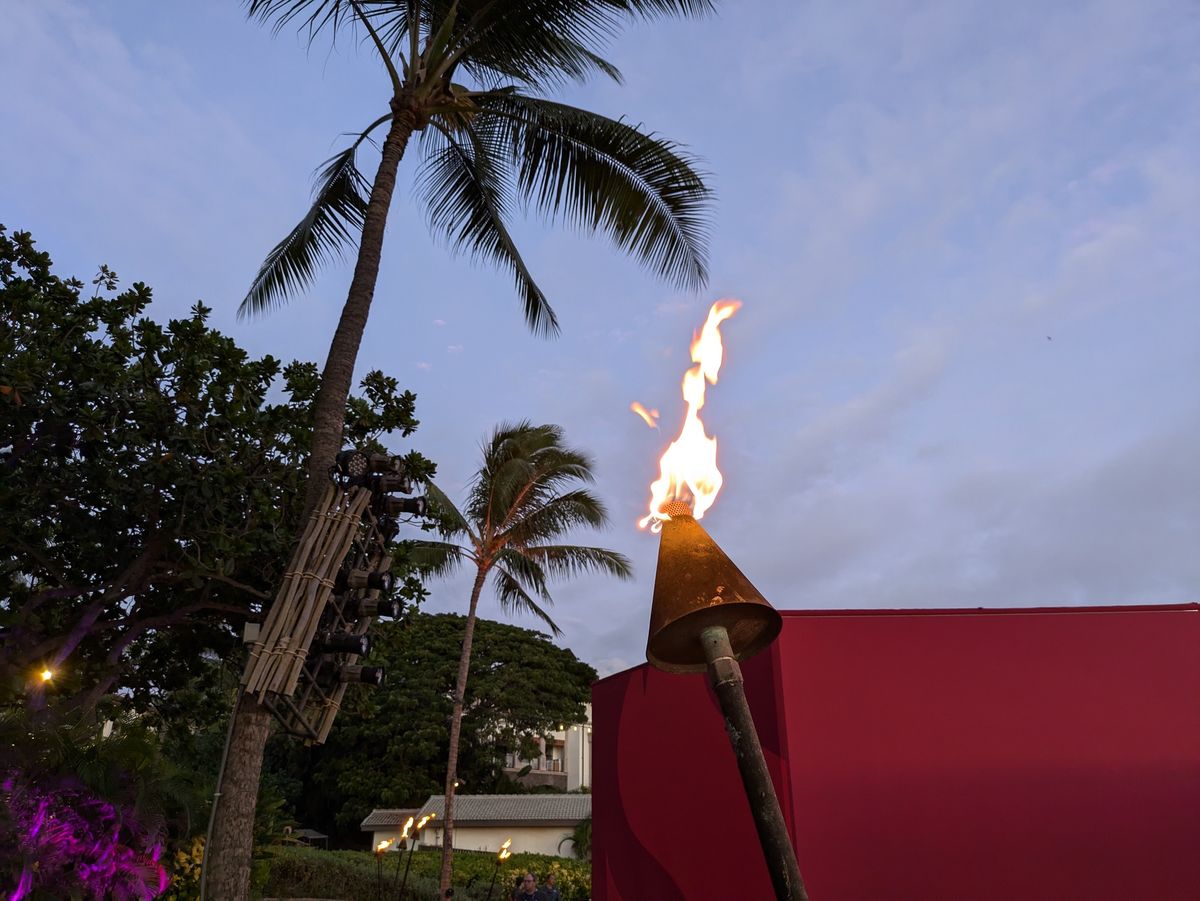 tiki torch at dusk shot by google pixel 8a
