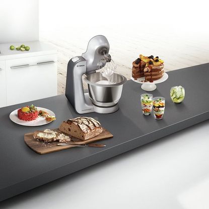 Bosch Stand Mixer on kitchen counter with cake, bread and dessert