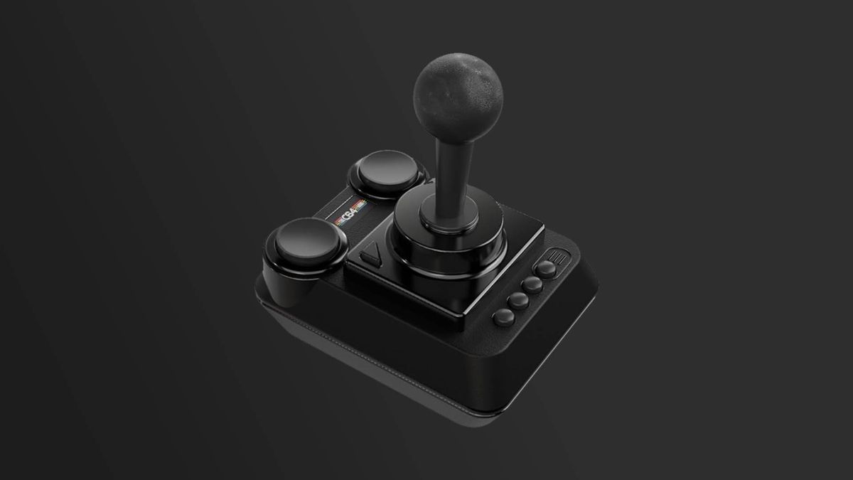 The C64 Mini Black Edition joystick with grey backdrop.