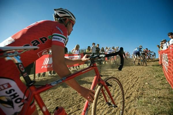 The elite men tackle a steep run up.