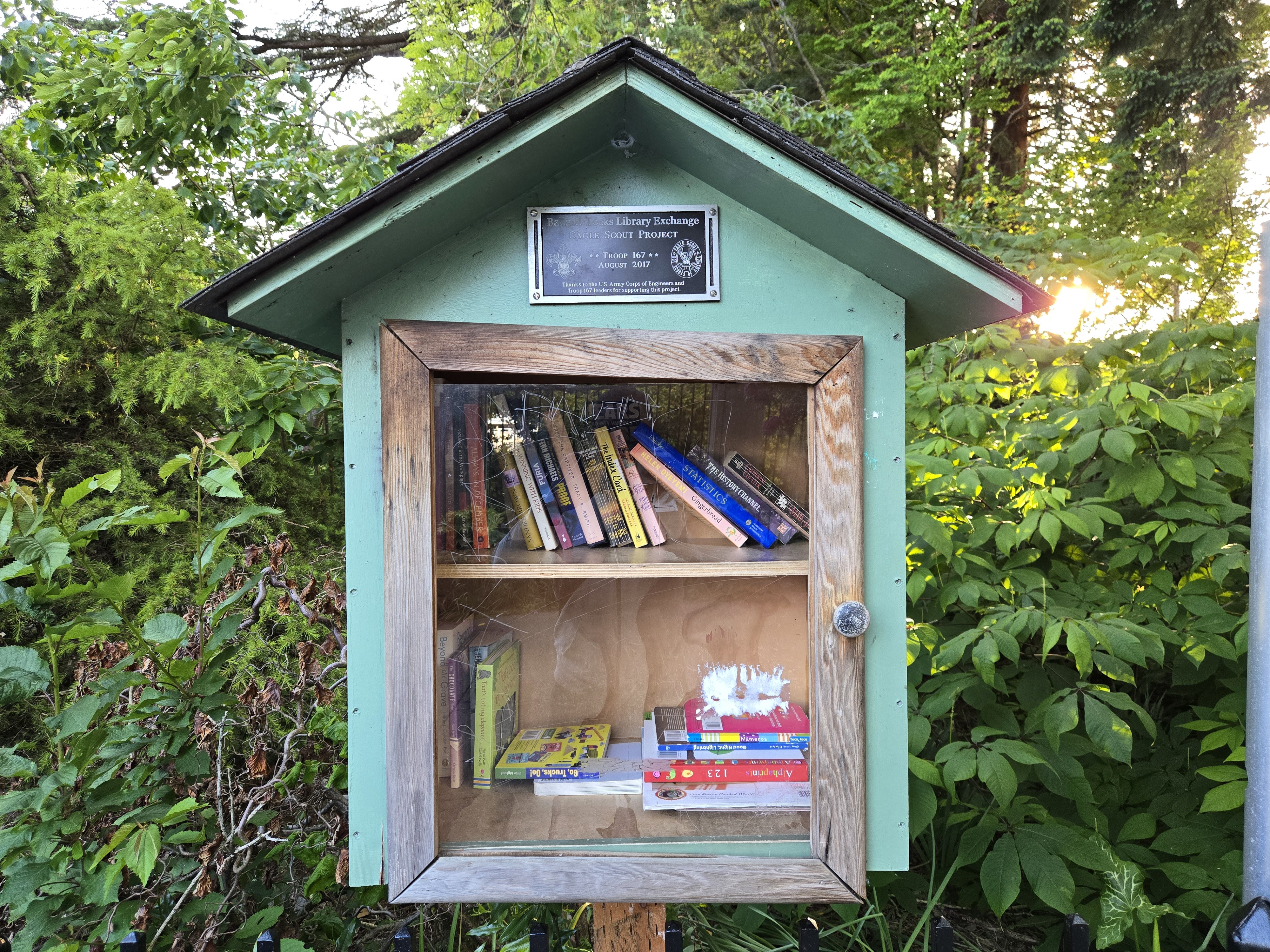 A wooden box with books inside