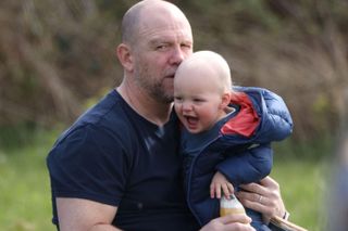 Mike Tindall with son Lucas as they watch Zara Tindall competing in the Barefoot Retreats Burnham Market International Horse Trials at Burnham Market, Norfolk