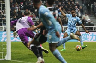 Manchester City’s Raheem Sterling scores their side’s fourth goal of the game during the Premier League match at St. James’ Park, Newcastle. Picture date: Sunday December 19, 2021